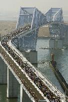 Running across Tokyo Gate Bridge