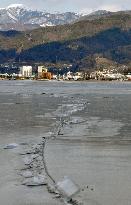 Streak of elevated ice cracks on Lake Suwa
