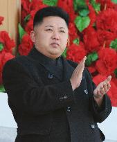 Kim Jong Un reviews military parade