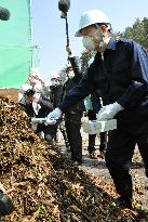 Toyama gov. inspects temporary site for disaster debris