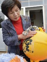 Japanese owner reunited with buoy lost in tsunami