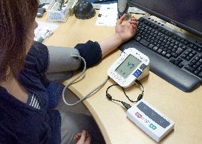 Using mobile network to check evacuees' blood pressure