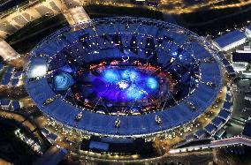 Olympic Stadium lit up in blue