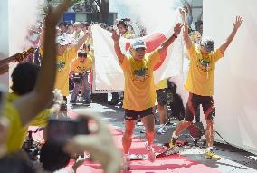 Fukushima men complete 13,000-km "thank you" marathon