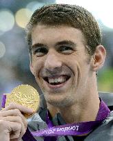 Phelps wins 3rd in Olympic men's 100m butterfly