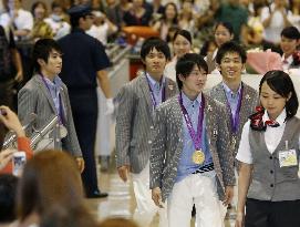 Japan men's gymnastics medalists return home