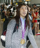 Japanese Olympic delegation arrives back in Japan