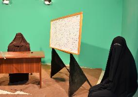 Egyptian woman working in niqab at TV station