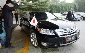 Japan envoy's car with new national flag
