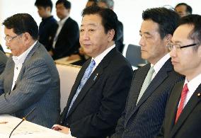 Japan lowers economic assessment
