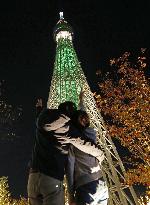 Tokyo Skytree lit up in pine tree color