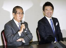 2 Japan parties to merge