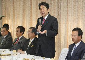 Abe aims to boost Japan economy with tax reforms