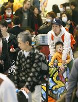 Returning travelers at Narita airport