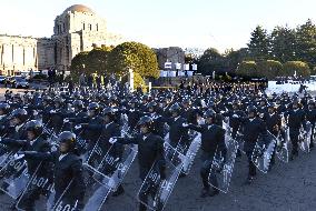 Riot police officers marching