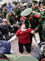 Workers, police crash in Beijing