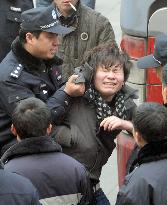 Workers, police crash in Beijing