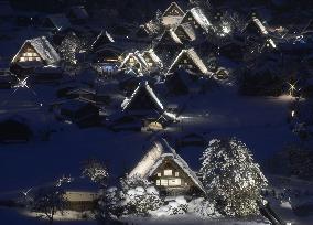 Snow-covered 'gassho-zukuri' houses lit up