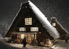 Snow-covered 'gassho-zukuri' houses lit up