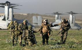 Japanese GSDF troops aboard U.S. Ospreys