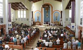 Guam Catholics offer mass for rampage victims