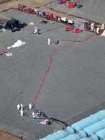 TEPCO transfers radioactive water to reliable container