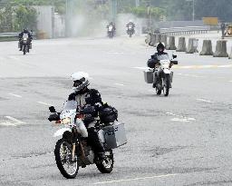 Motorcyclists cross Korean DMZ