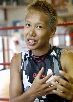 Transgender boxer overcomes struggles to become world champion