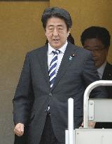 Japan prime minister returns home