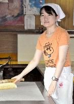 Young woman ventures into world of washi papermaking