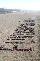 Human letters on U.S. beach