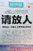 Chinese paper calls for release of reporter