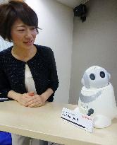 Watching over family using robot
