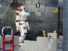 17 humanoid robots compete in DARPA Robotics Challenge