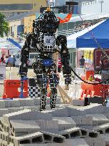 17 humanoid robots compete in DARPA Robotics Challenge