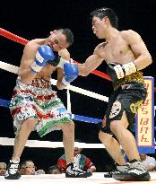 Miura scores 9th-round TKO