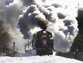 Steam locomotive runs through Kushiro Marsh in winter