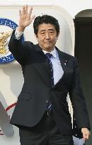 Abe leaves for Davos