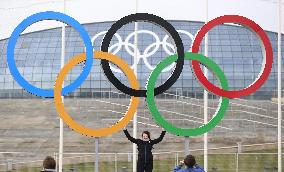 Woman with Olympic emblem in Sochi