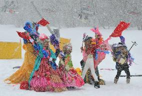 Winning team performs in masquerade ski event