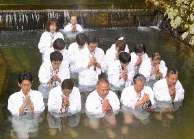 Buddhists soaked in cold water