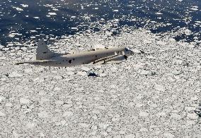 MSDF patrol plane flies over drift ice in Okhotsk Sea