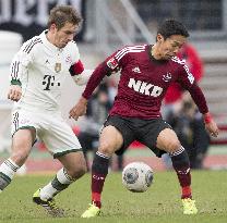 Nuremberg's Kiyotake competes against Bayern Munich
