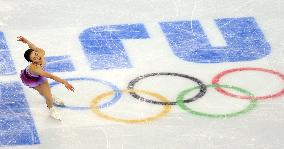 Asada skates above Olympic rings in team figure skating at Sochi