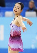 Asada smiles after short program in team figure skating at Sochi