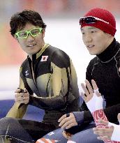 Speed skater Kato chats with S. Korea's Mo at Sochi