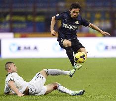 Inter Milan's Nagatomo evades tackle