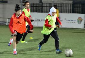 Jordanian women's soccer player wears headscarf