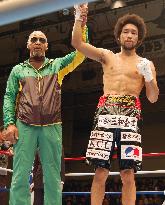 New Japan super featherweight champion Naito celebrates with father