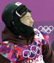 Japan's Aono looks at scoreboard in Sochi